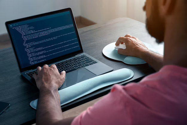 A man is engaged in computer programming